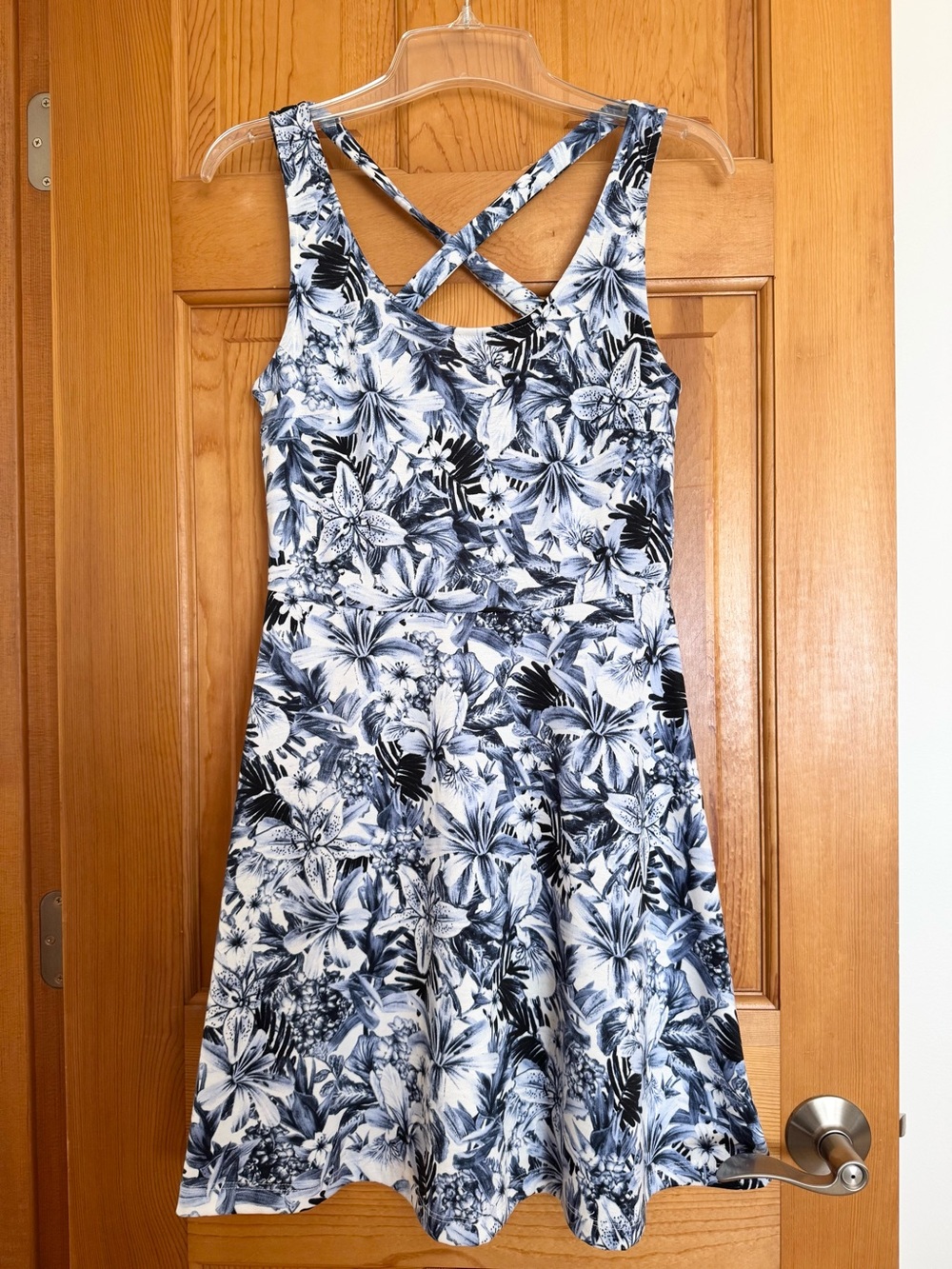 H & M Sleeveless sundress with blue and white floral print. 
Size Small